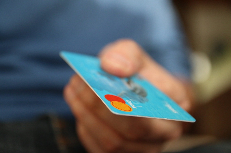 hand holding credit card