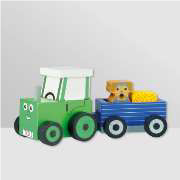 A wooden toy tractor with trailer, dog and haybale included.