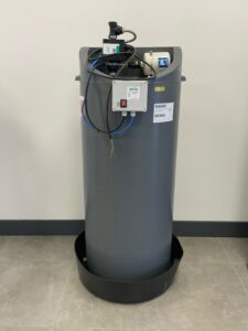 An image of a large grey cylindrical cold water storage tank with a control box at the top of the product and a black base.