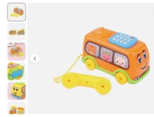 A Toy telephone in the form of an orange bus with a blue phone keypad on top of the bus and with a bright yellow phone receiver (ear/mouthpiece) attached by a cord to the back of the bus. The front of the bus has a smiley face and there are three side windows with a cartoon-like animal's face in each window.