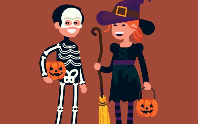 Two children wearing Halloween costumes