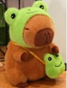 A capybara plush toy wearing a frog hat and carrying a bag