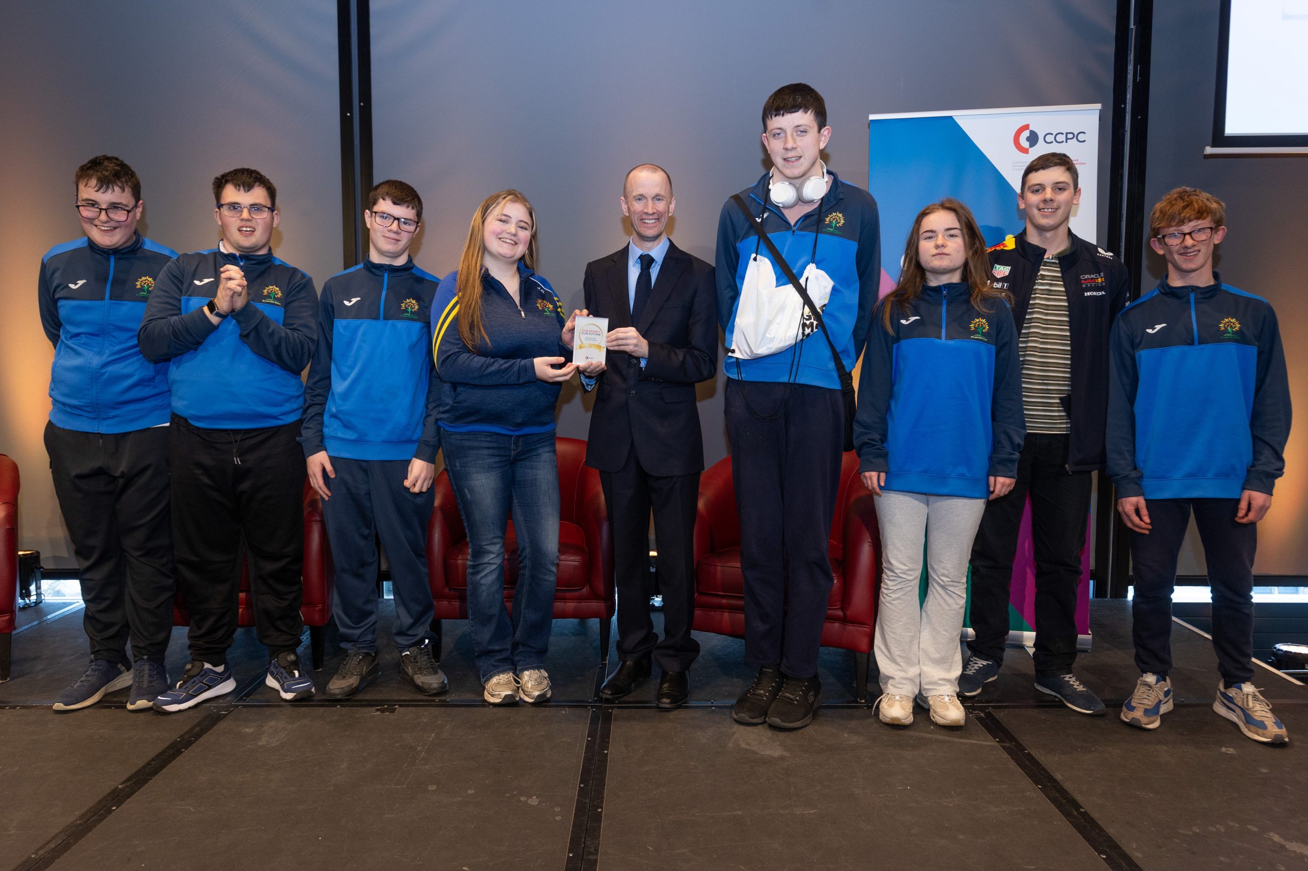 CCPC Chairperson Brian McHugh presenting students from St. Laserian with their Our Money, Our Future award