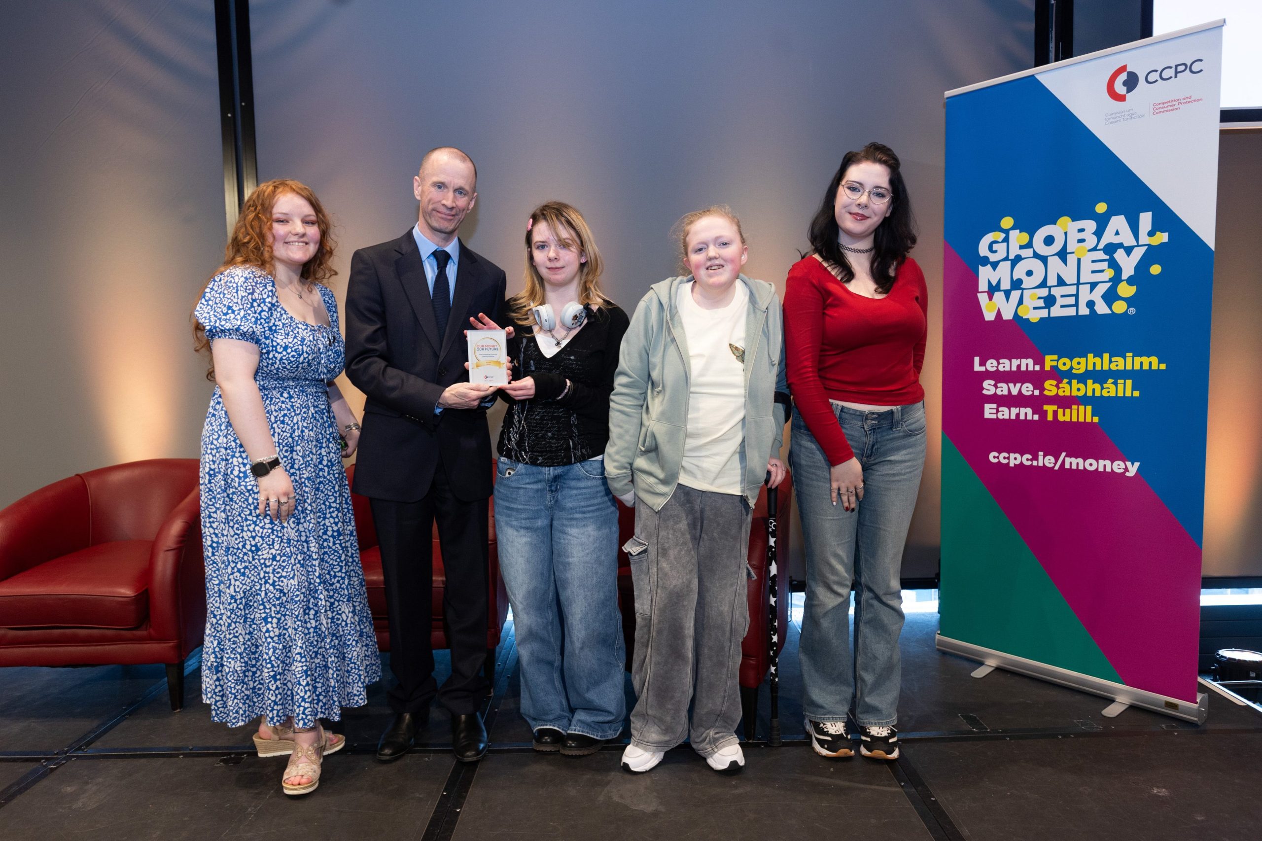 CCPC Chairperson Brian McHugh presenting students from West Wicklow Youthreach with their Our Money, Our Future award