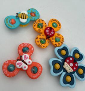 An image of four colourful fidget spinners with the spinners having two, three, four and five arms.