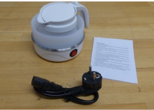 An image of a white travel kettle, plug with lead and a product document.